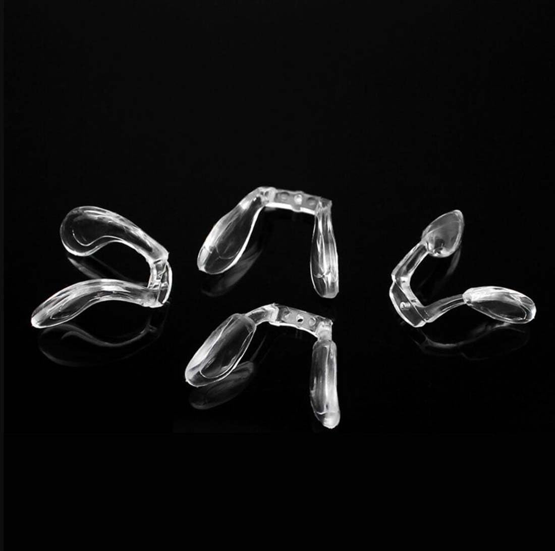 Two pairs of clear replacement nose pads for eyeglasses