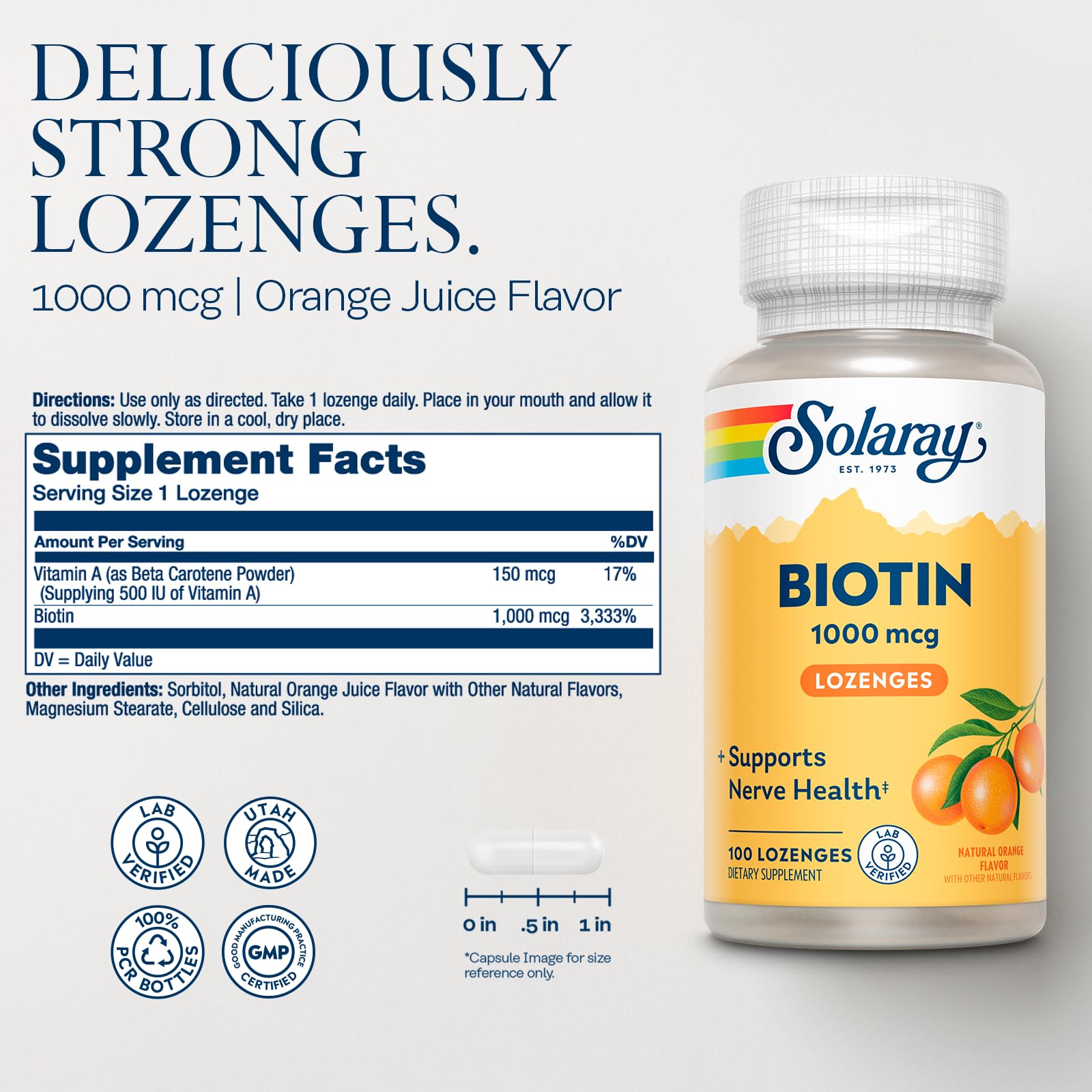Orange-flavored biotin lozenges on a white surface