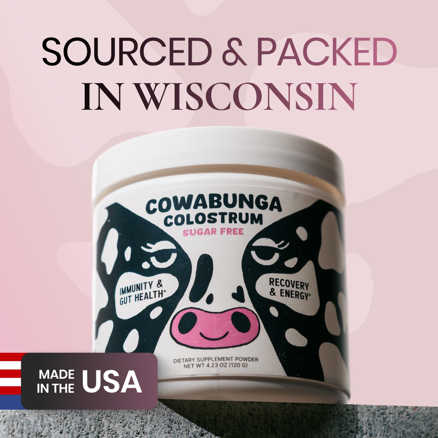 Colostrum powder being added to a glass of water