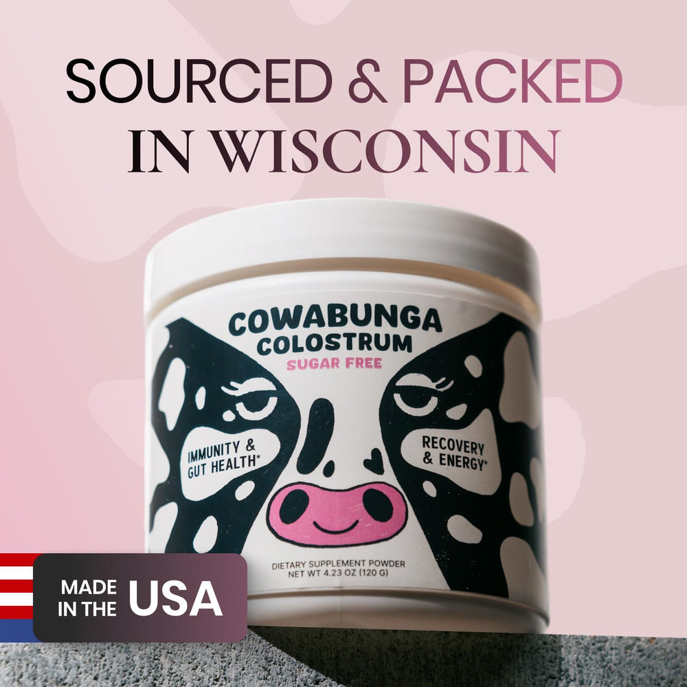 Colostrum powder being added to a glass of water