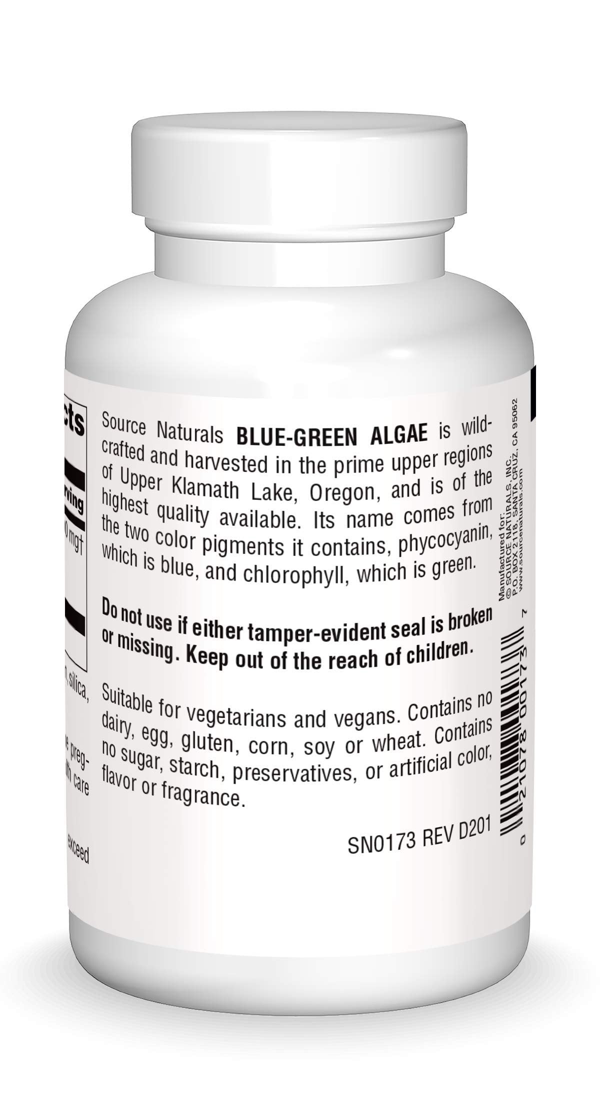 Close-up of blue green algae tablets in a bottle
