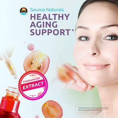 Resveratrol tablets beside bottle on white background