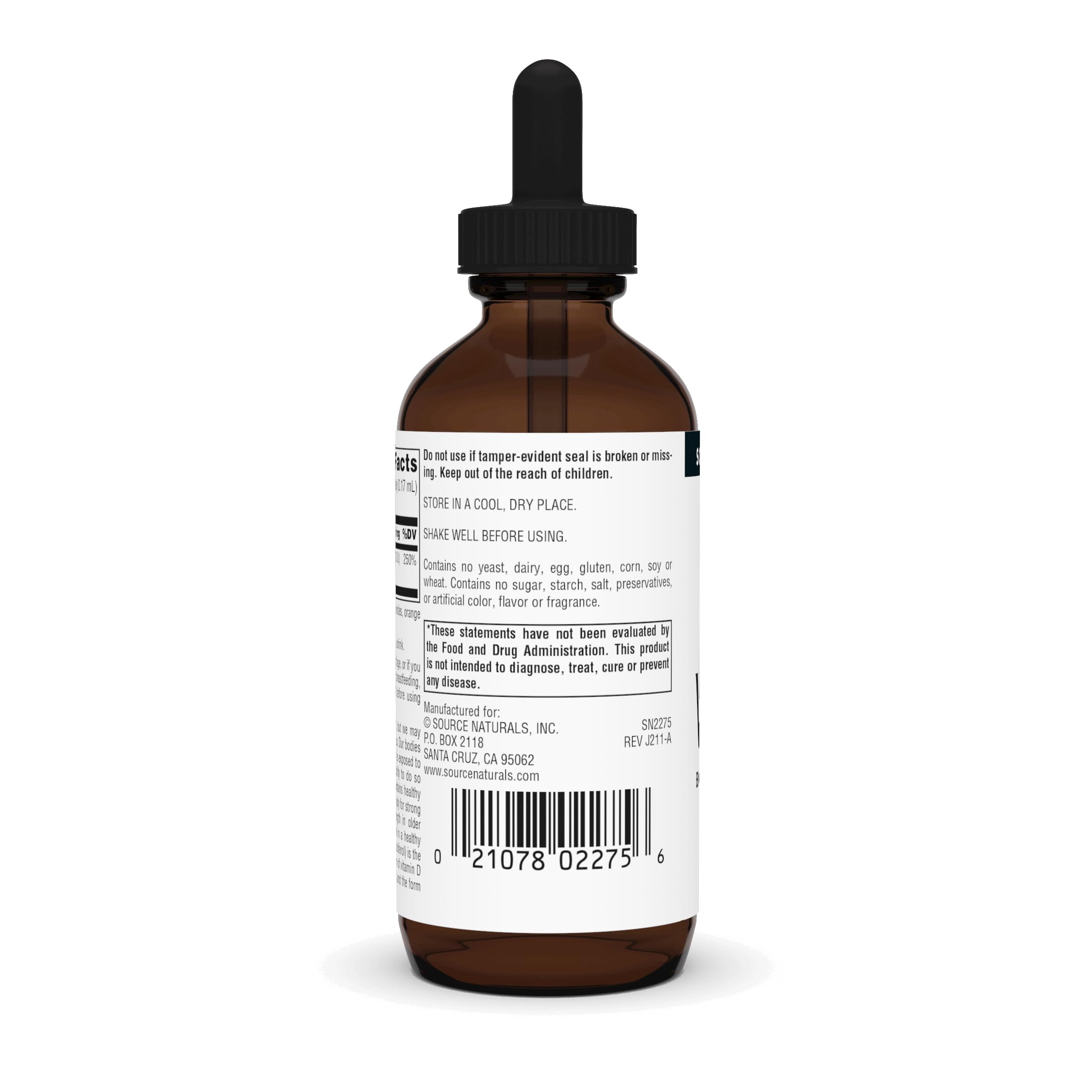 Dropper dispensing Vitamin D-3 liquid into a glass