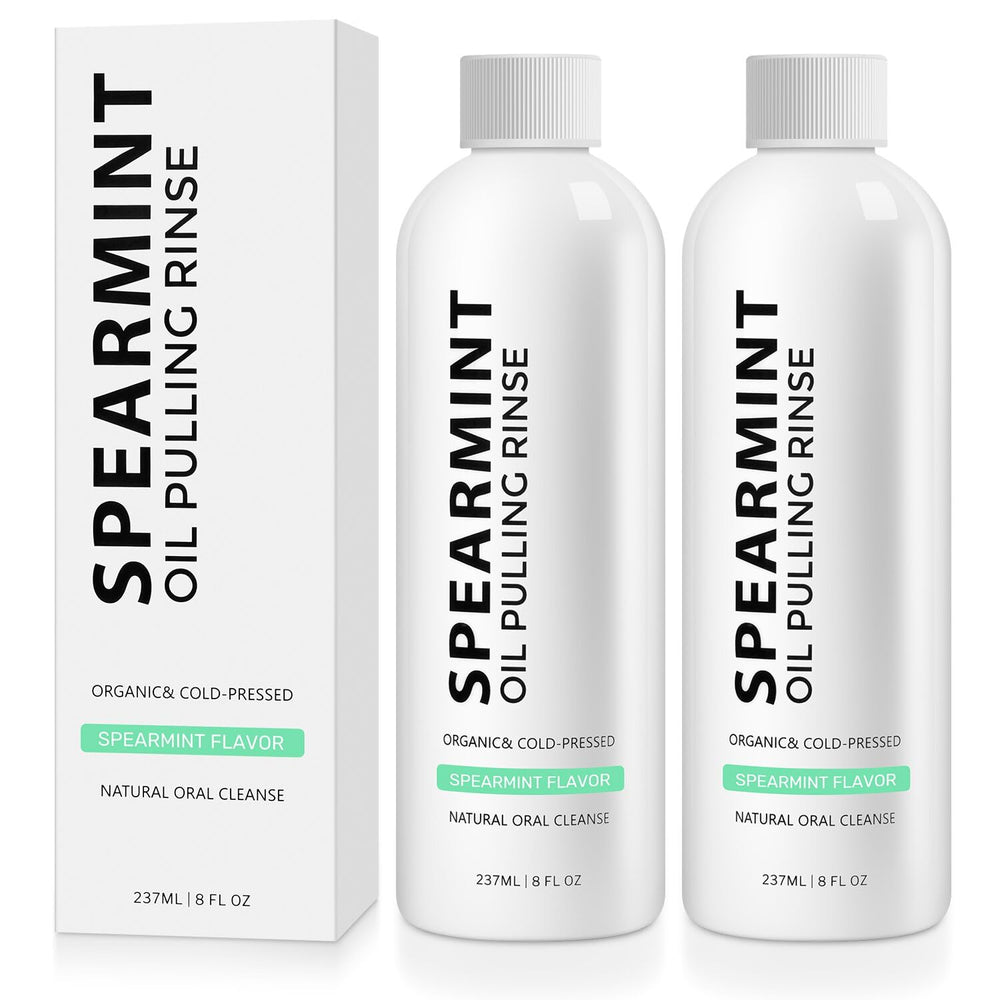 Two bottles of Spearmint Oil Pulling Rinse