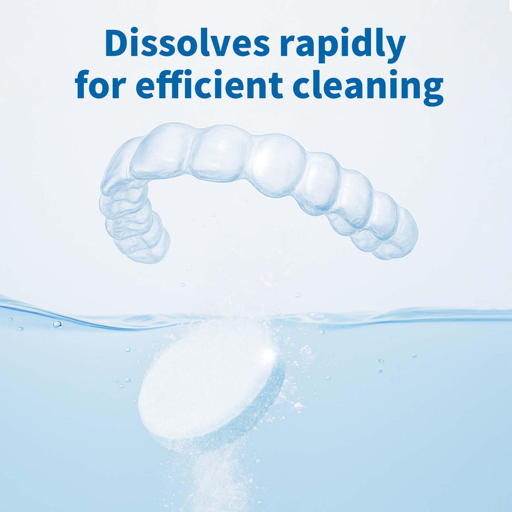 Tablet dissolving in warm water to clean dental appliances