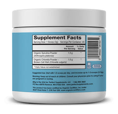 Scoop of spirulina powder on white surface