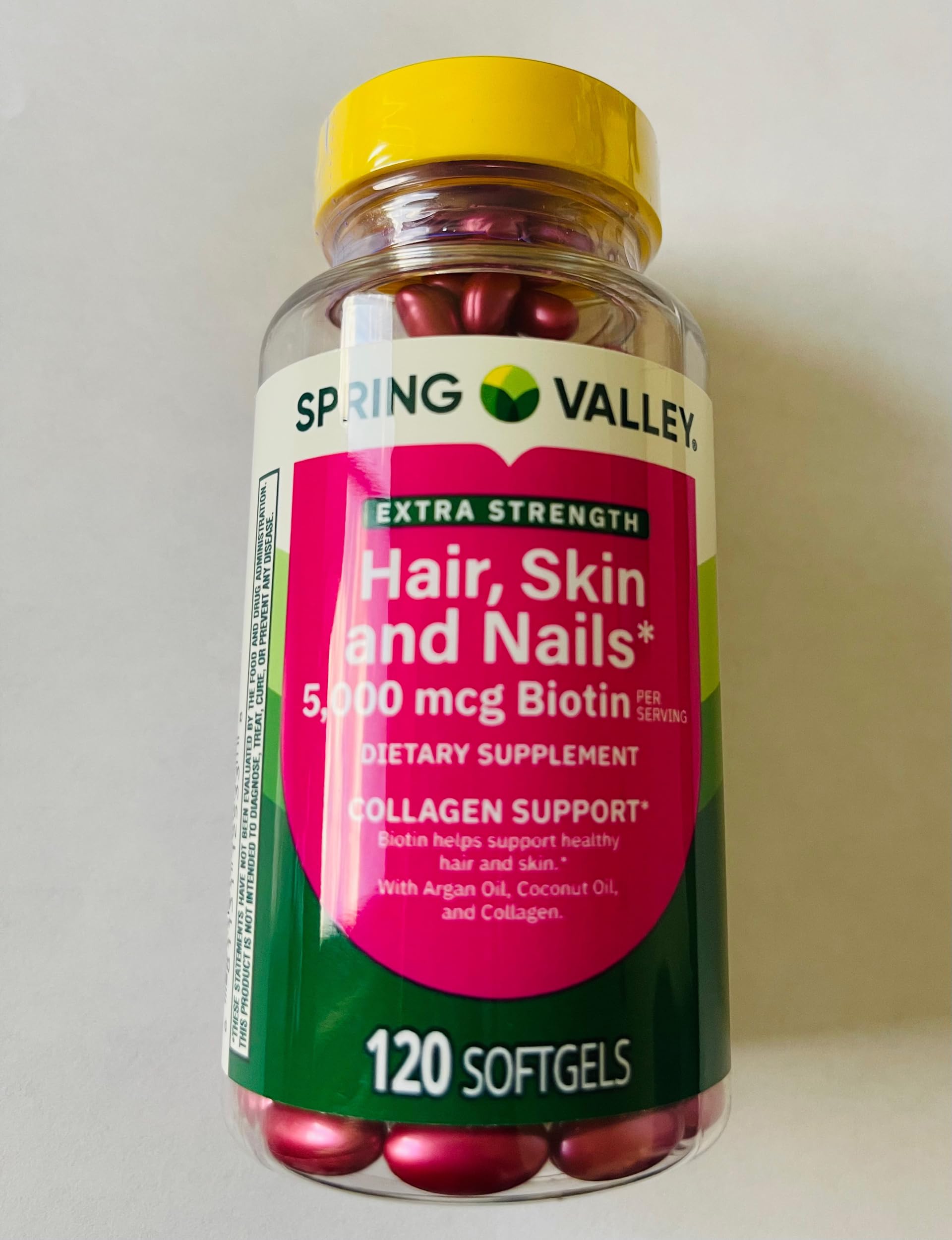 Bottle of Spring Valley Extra Strength Biotin Hair Skin Nails Dietary Supplement 5000 mcg, 120 softgels