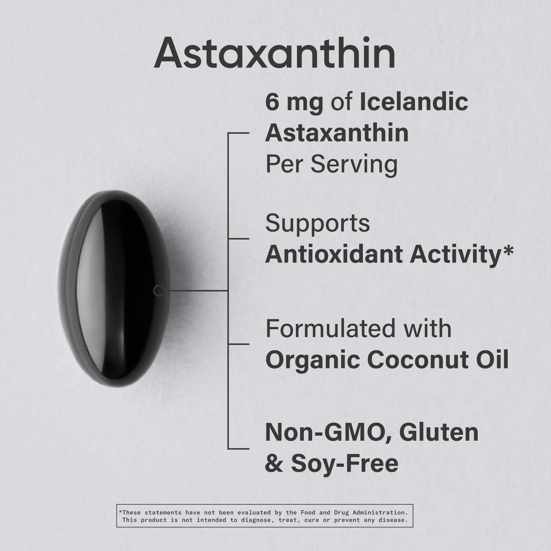 Close-up of a single 6 mg astaxanthin softgel capsule with coconut oil