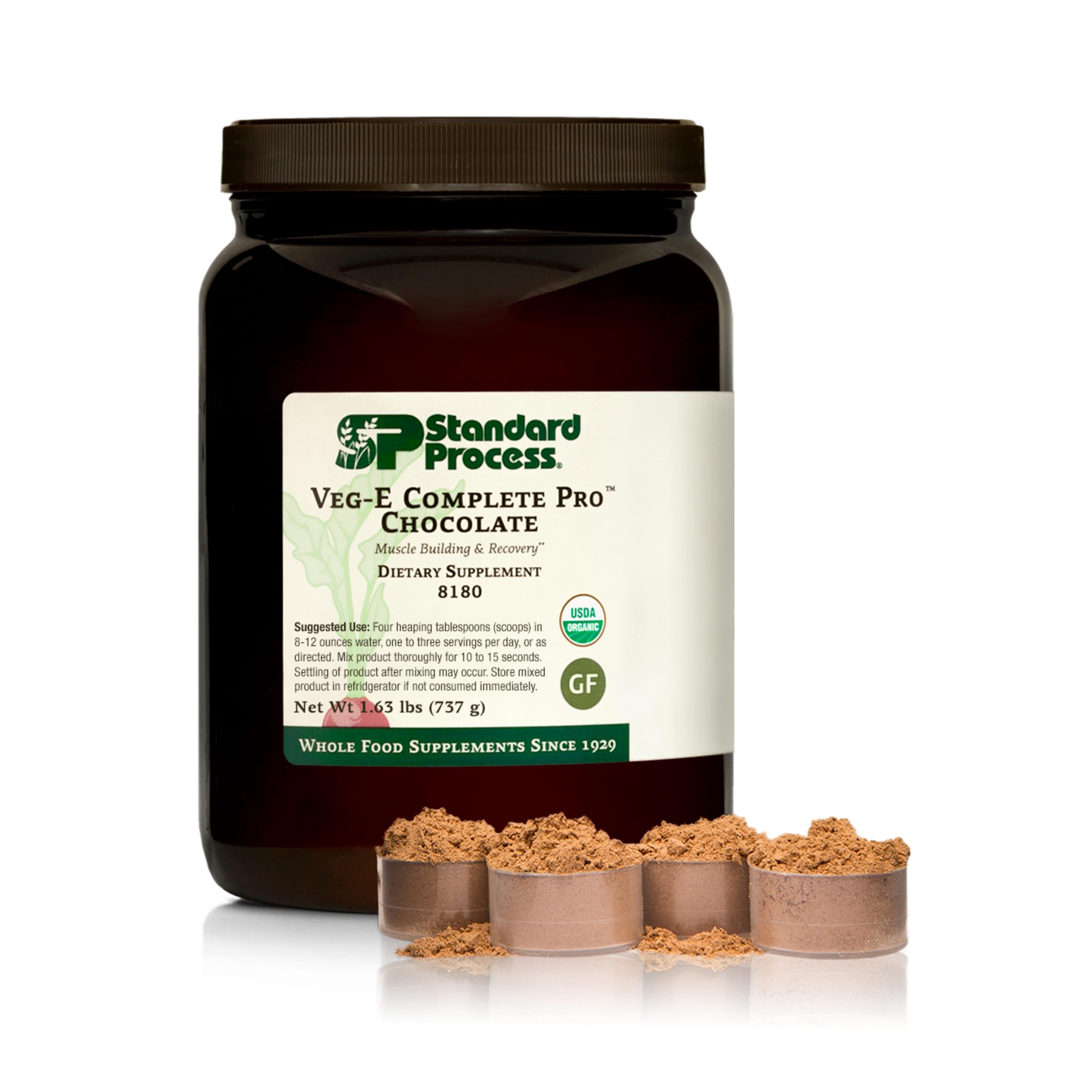 Standard Process Veg-E Complete Pro chocolate powder pours into a glass for a protein-packed shake.