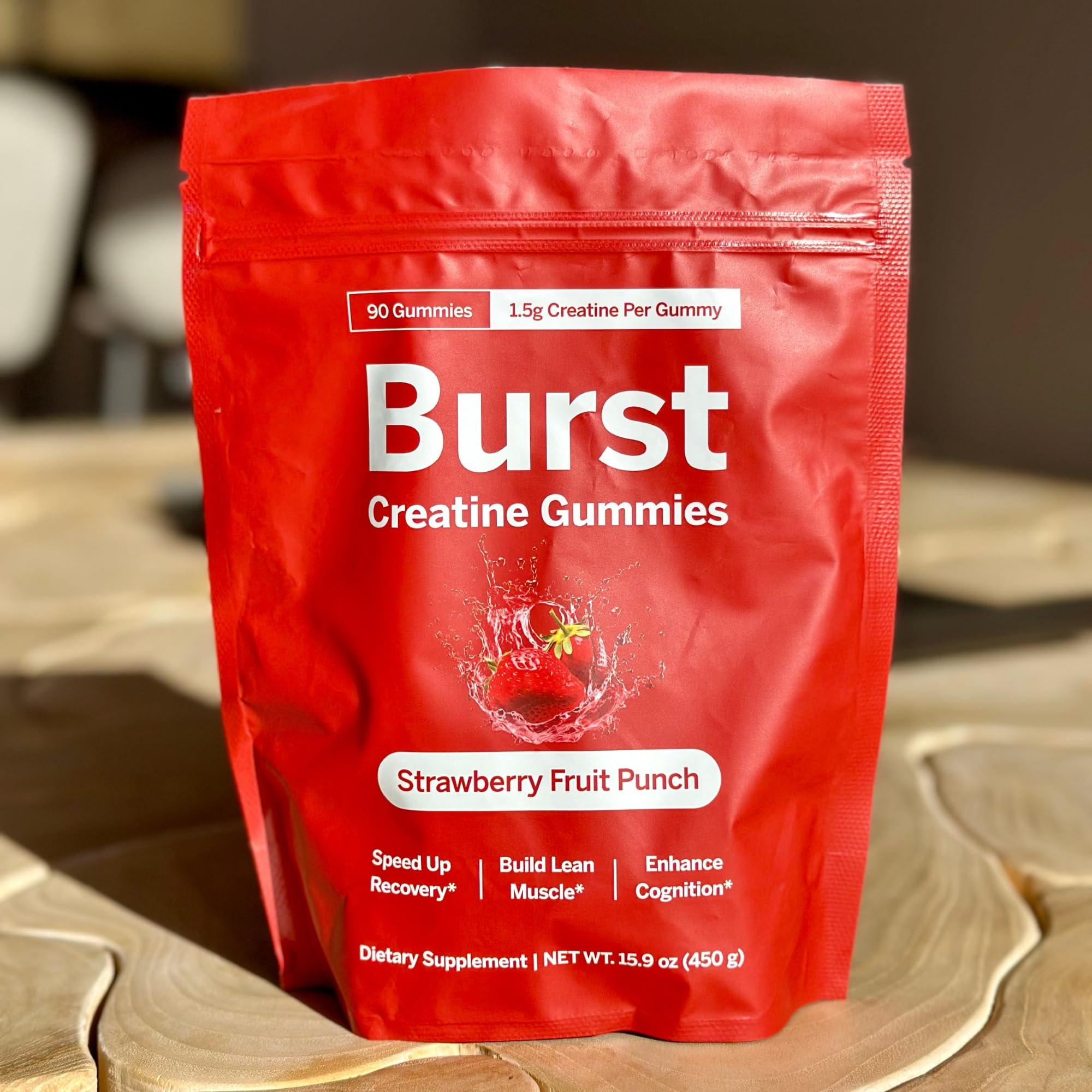 Assorted strawberry-flavored gummies on white background