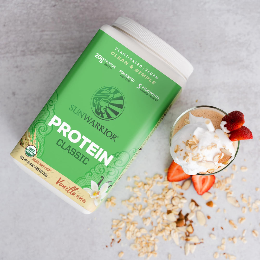 Vanilla protein powder beside a bowl of oats