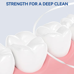 Mint PTFE floss being used between teeth