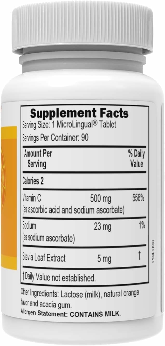 Vitamin C 500 mg MicroLingual tablet next to a glass of orange juice