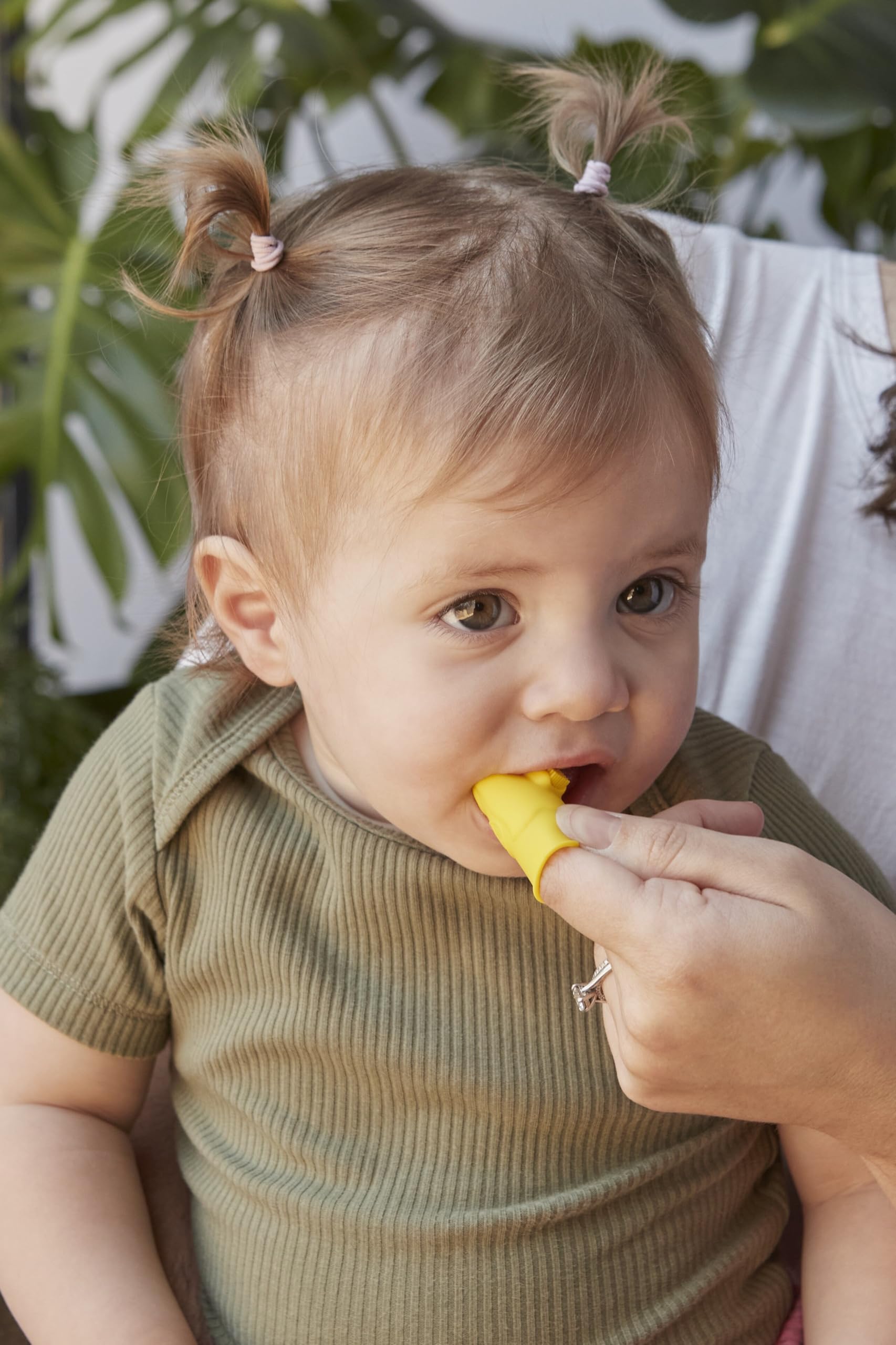 Built-in bite block protecting parents' fingers