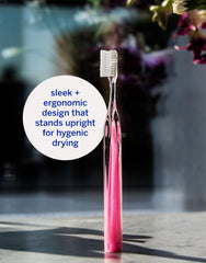 Ergonomic Lucite handle on Supersmile Pink Diamond toothbrush