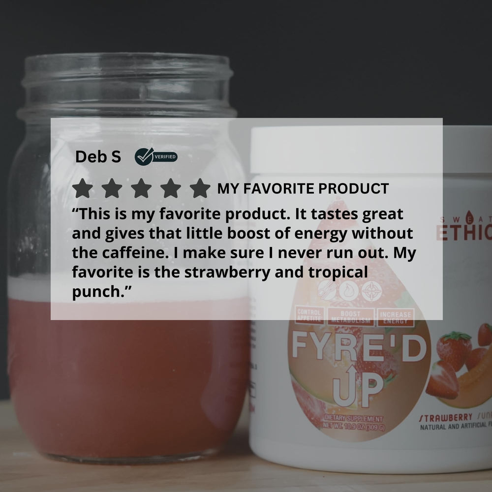 Scoop of FYRE’D UP powder next to a measuring cup