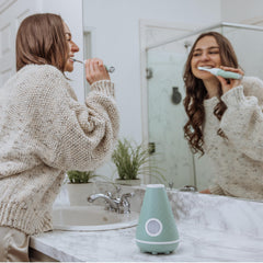 Toothbrush displaying dual speed settings: Super Clean and Sensitive Clean