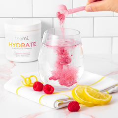 Teami Electrolytes Powder with glass and ice suggests a crisp, sugar-free refreshment