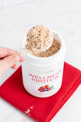 Teami vegan protein powder shake-pour demonstrates smooth, easy-dissolve blend.