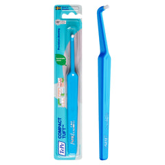 Close-up of the single tuft and angled head of TePe toothbrush