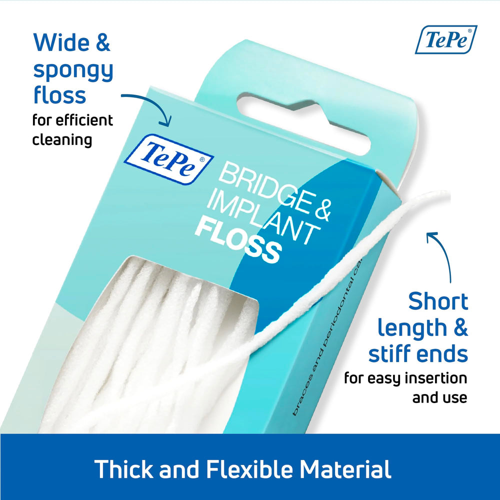 Implant dental floss around an implant and braces close up