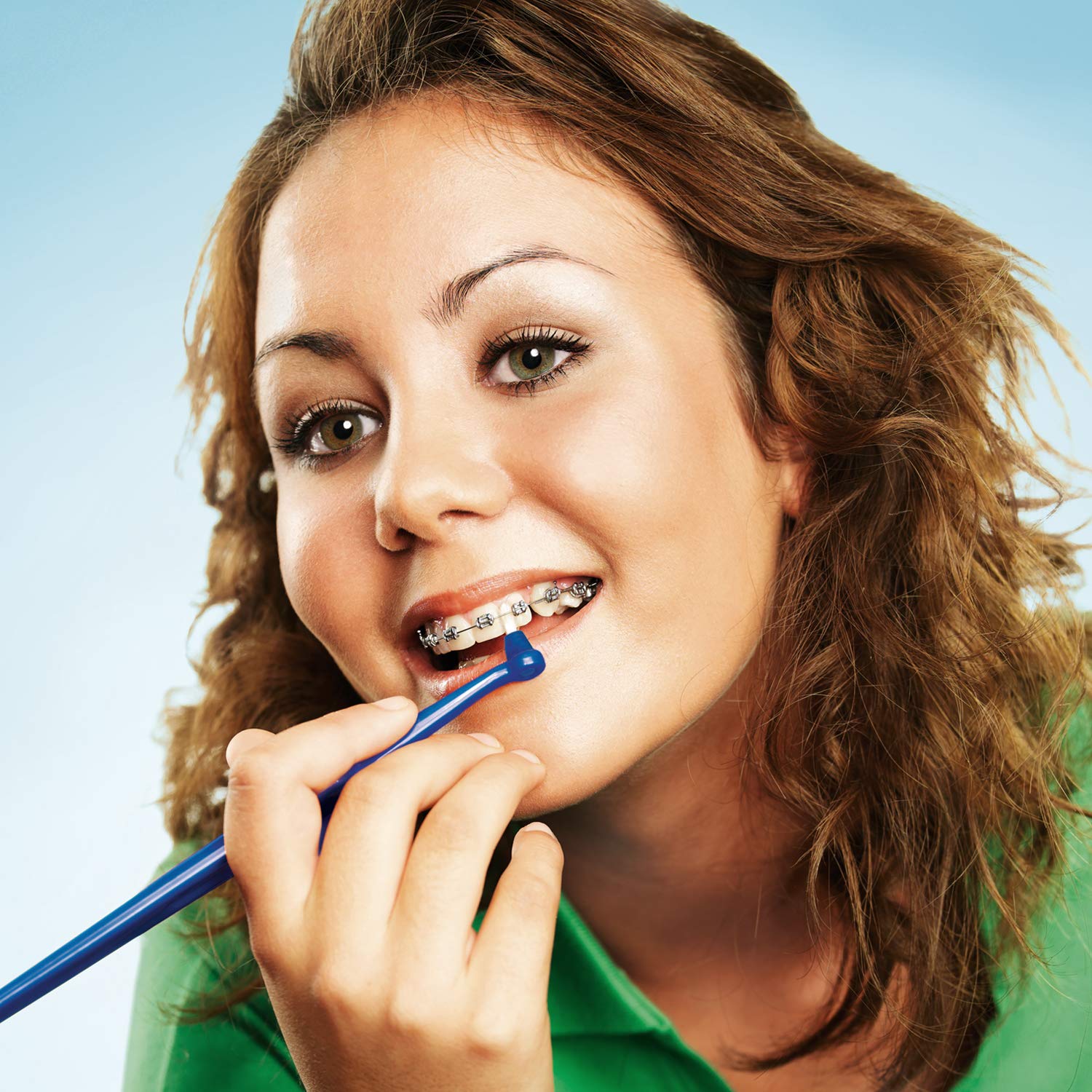 Brush tip reaching behind the last tooth