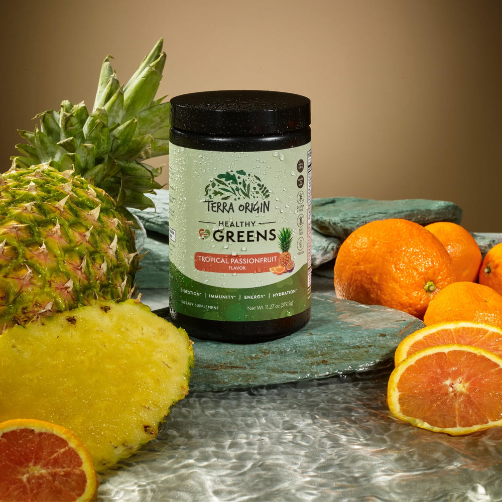 Close-up of Terra Origin Greens Powder bottle with tropical passion fruit flavor label