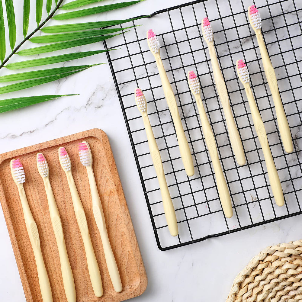 Yellow disposable toothbrushes in bulk ready for donation
