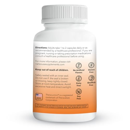 Turmeric capsules next to a scoop of turmeric powder