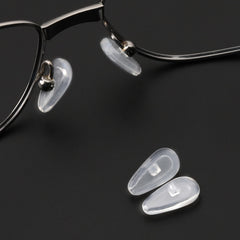 Close-up view of Tolaxy soft silicone nose pads showing ergonomic shape