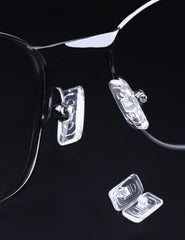 Close-up of screws and micro screwdriver included with Tolaxy nose pads