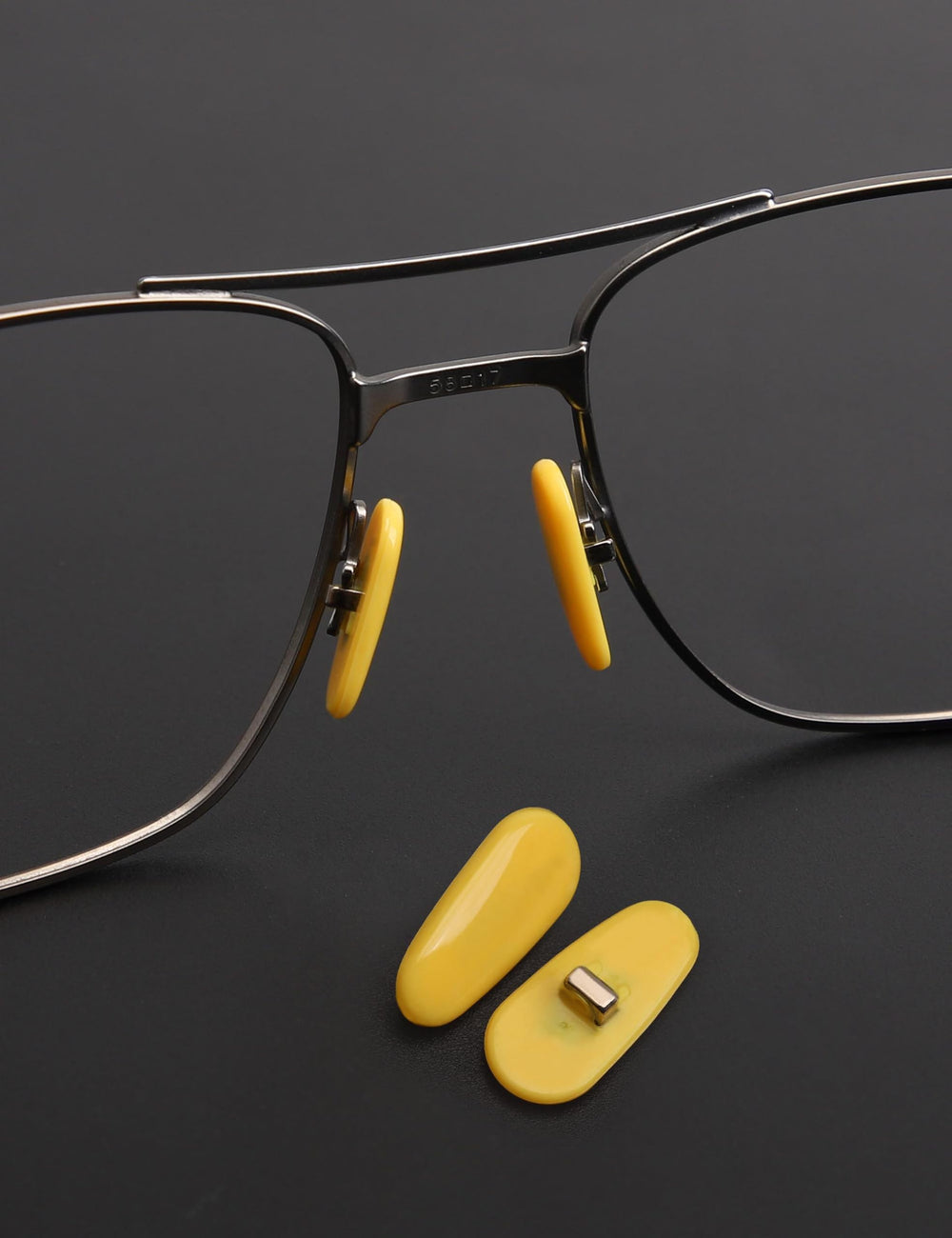 Plug-in nose pads being installed on Ray-Ban frames