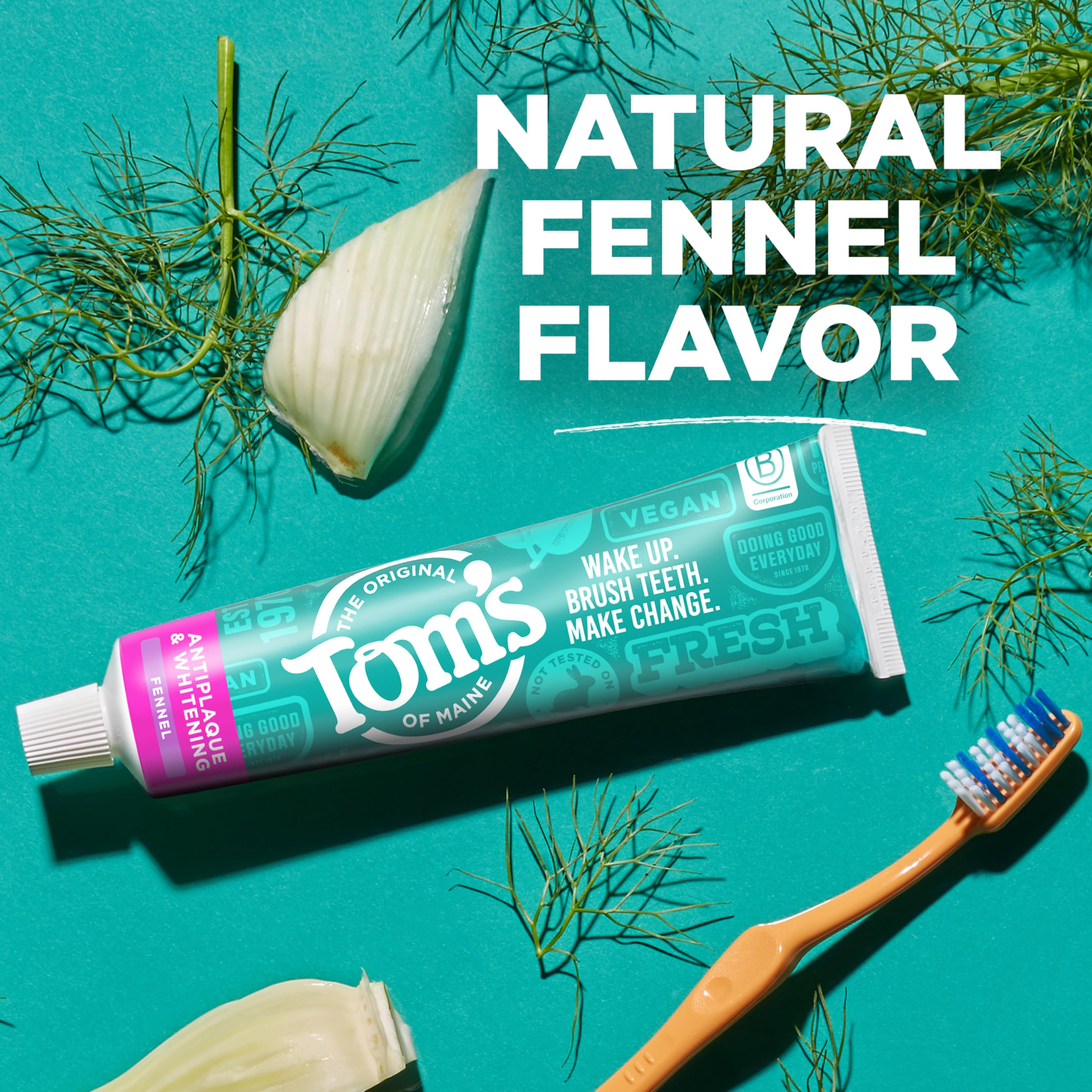Toothpaste tube standing upright with cap on
