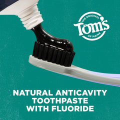 Close-up of Tom's of Maine charcoal toothpaste tubes showing 4 oz size