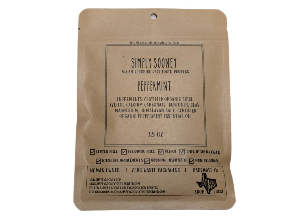 Zero waste peppermint tooth powder in a jar with packaging-free presentation.