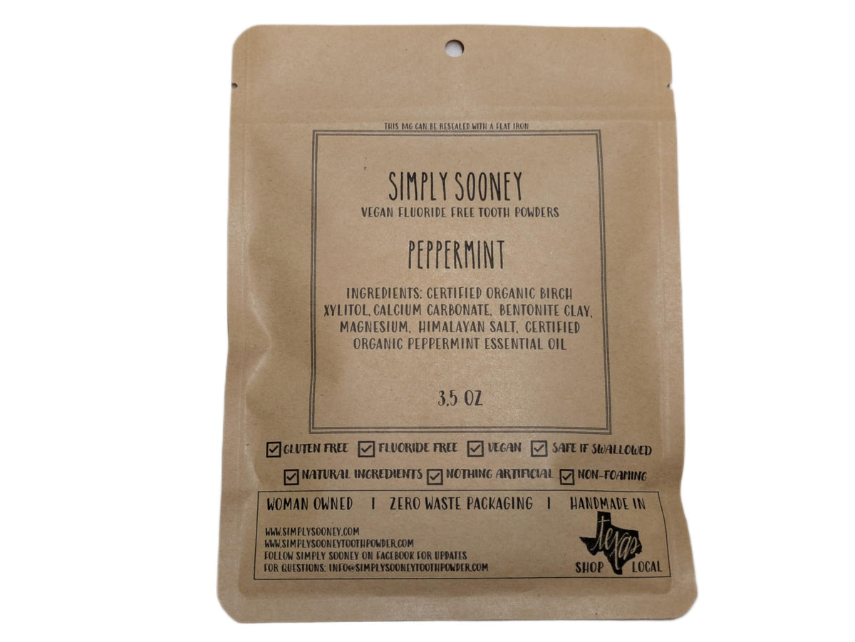 Zero waste peppermint tooth powder in a jar with packaging-free presentation.