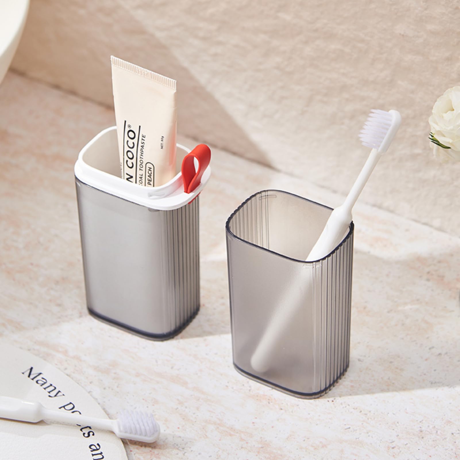 Open Topavatop travel case showing toothbrush and rinse cup