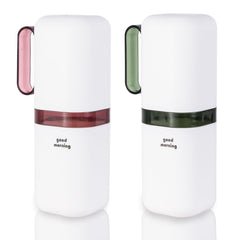 Purple and green travel toothbrush holder with rinse cup, front view