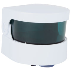 Portable vibrating denture cleaner in a bathroom setting