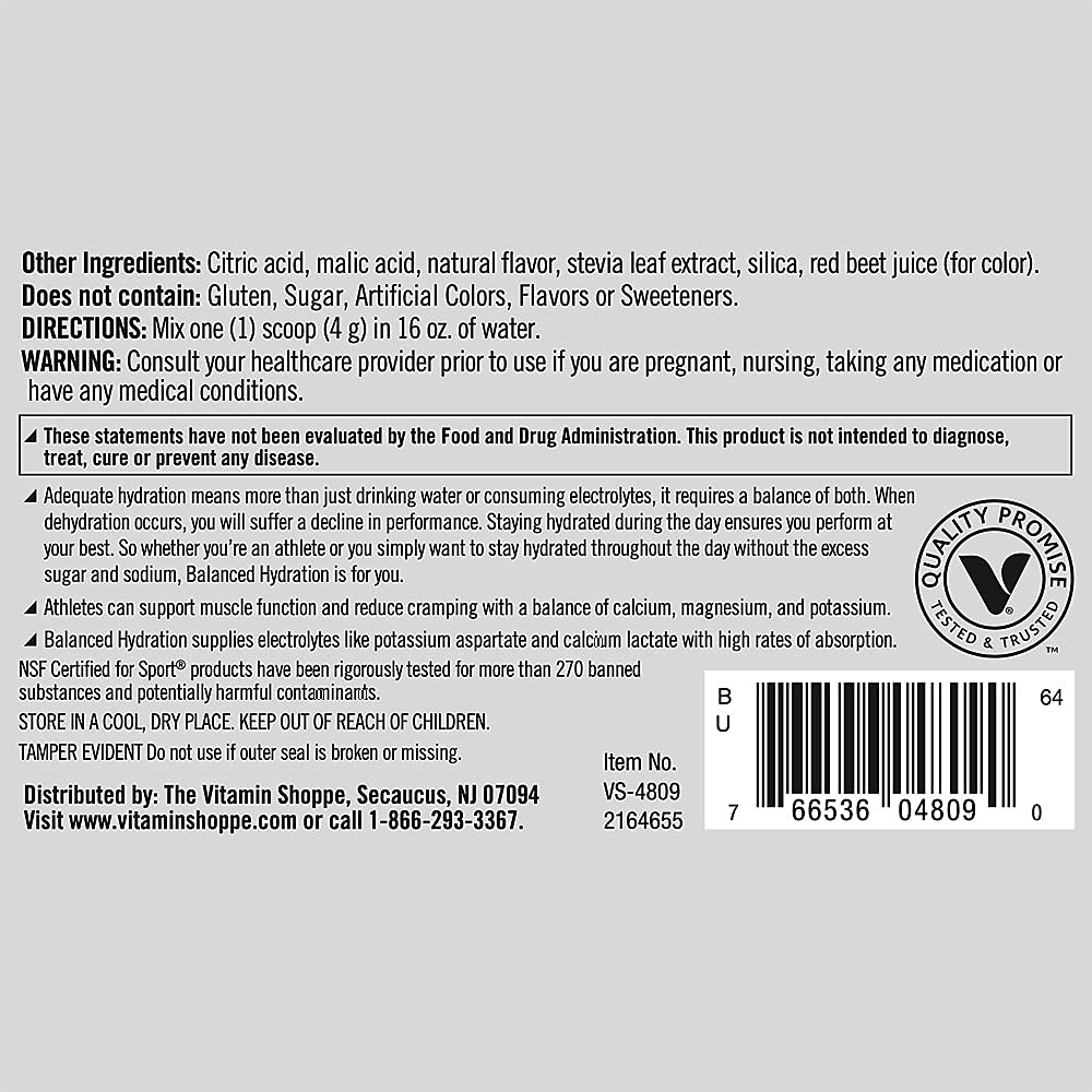 Dissolving True Athlete Balanced Hydration Powder in a glass of water.