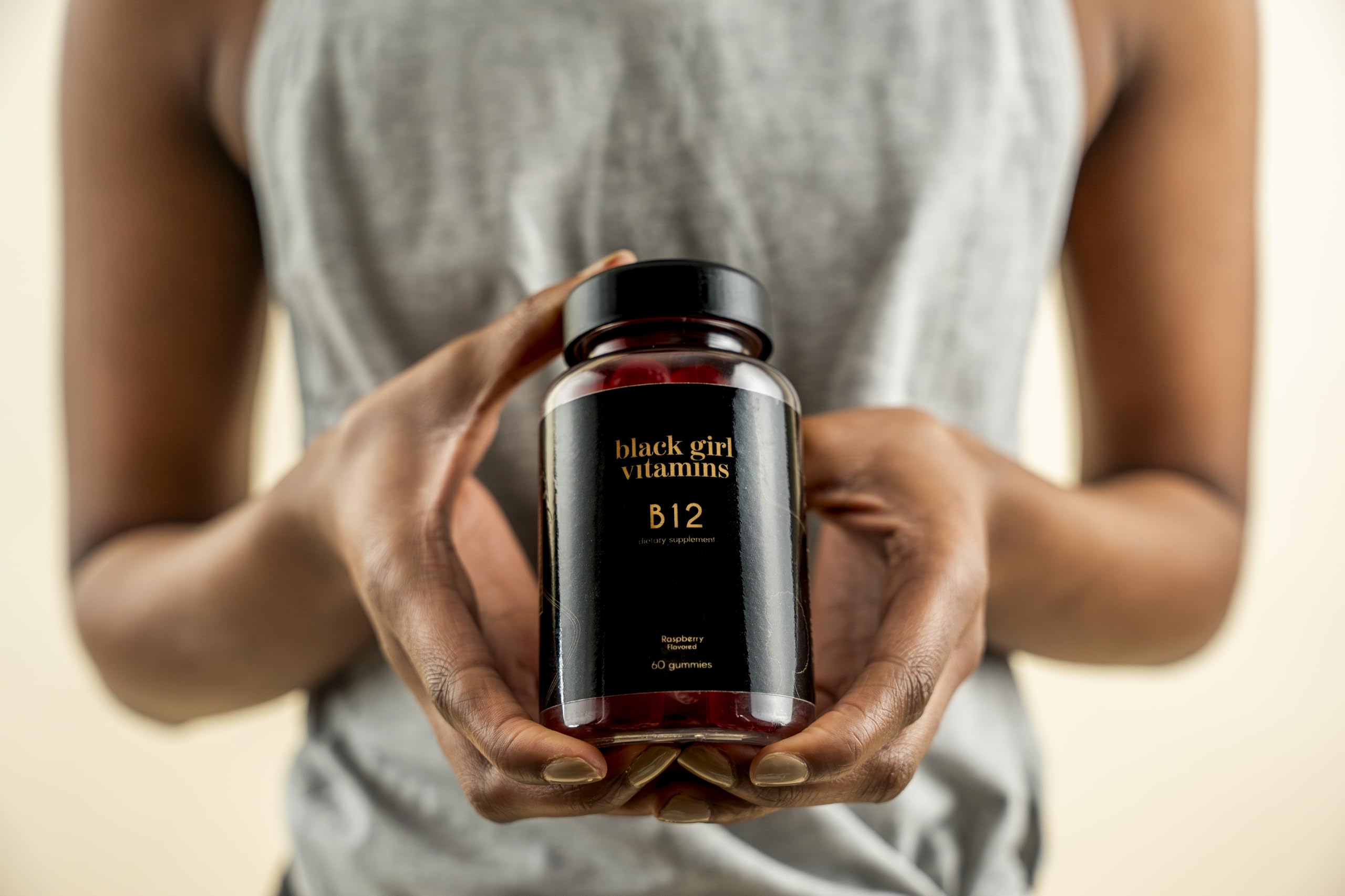 Two Raspberry-flavored B12 Gummies on a white surface
