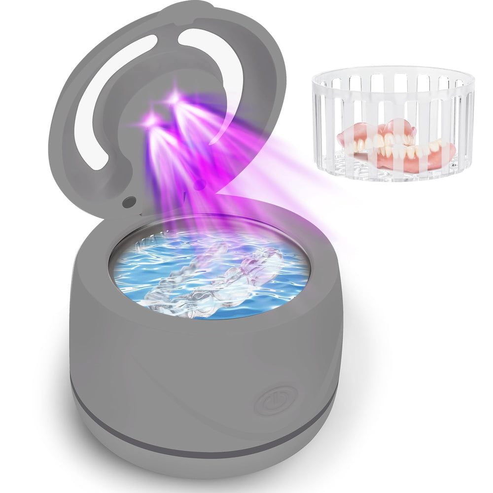 Ultrasonic denture cleaner device in black on a countertop