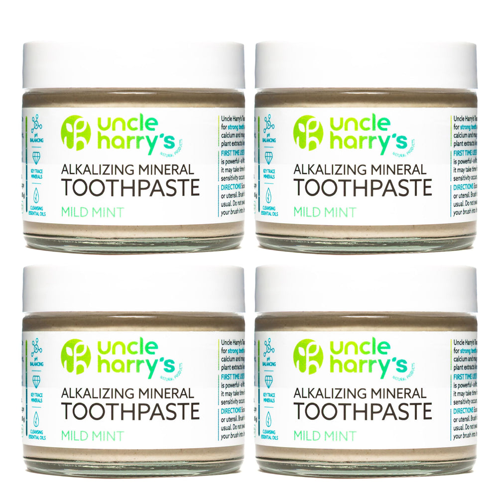 Front view of Uncle Harry's Mild Mint Remineralizing Toothpaste 4-pack in eco-friendly glass jar