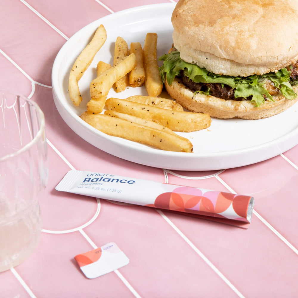 Lifestyle image featuring Unicity Balance Mixed Berry Stick Packs