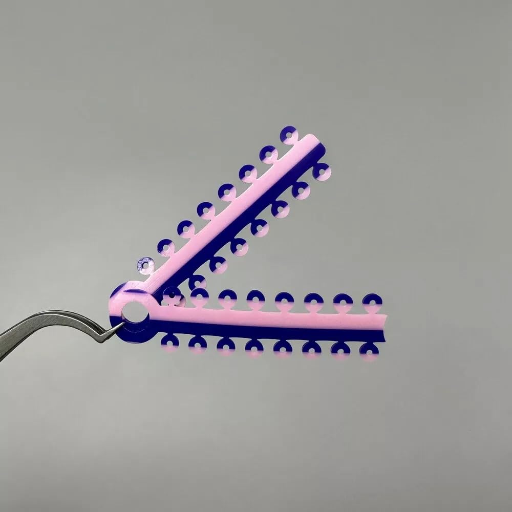 Purple and pink two-color braces ligature ties on display