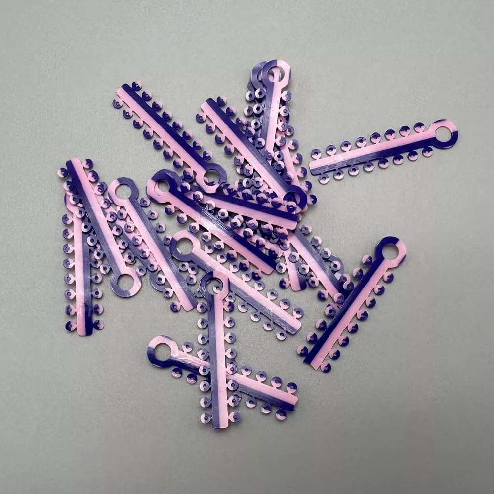 Gradient purple-to-pink orthodontic ligature ties