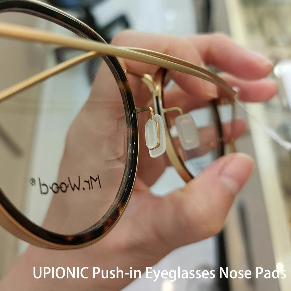 Packaging showing five pairs of clear nose pads