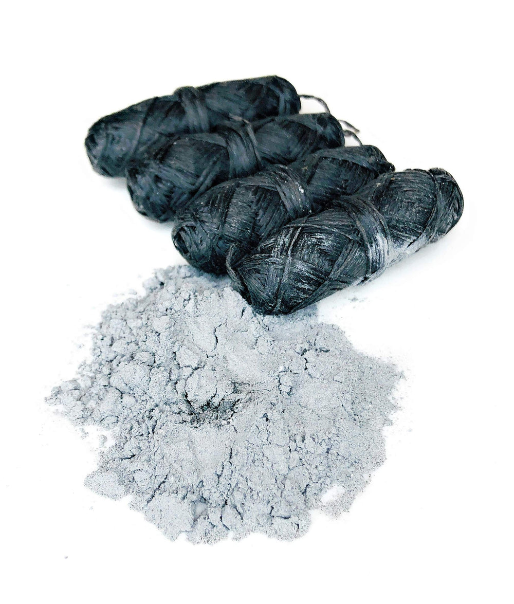 Peppermint essential oil infused bamboo charcoal dental floss in vegan packaging