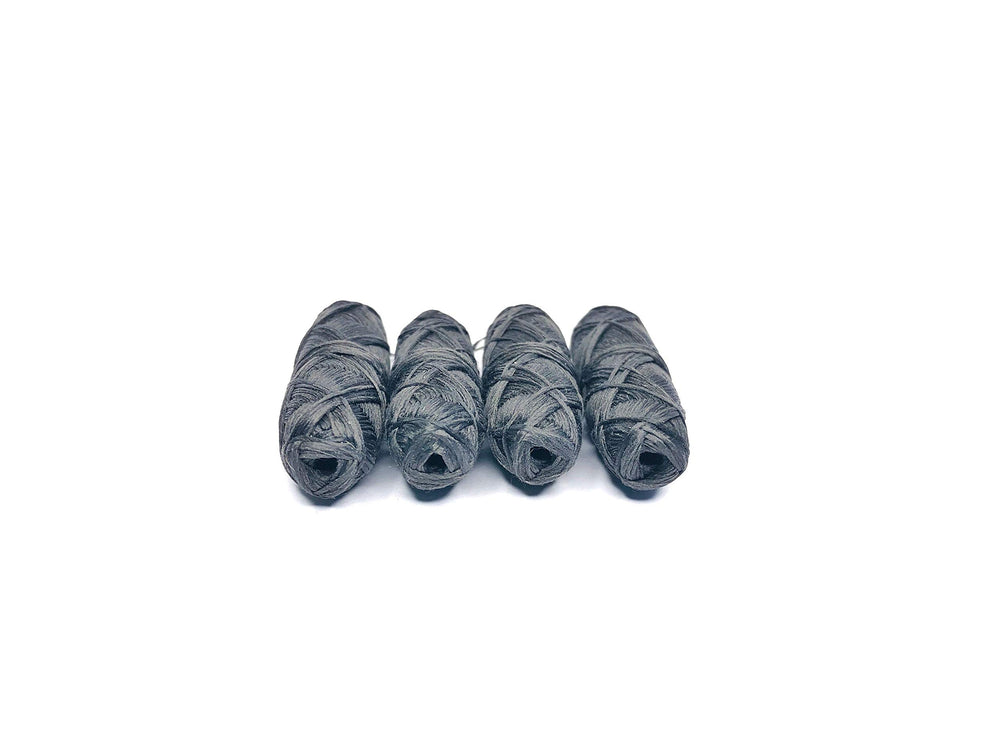 Plastic-free packaging for vegan bamboo charcoal dental floss 4-pack