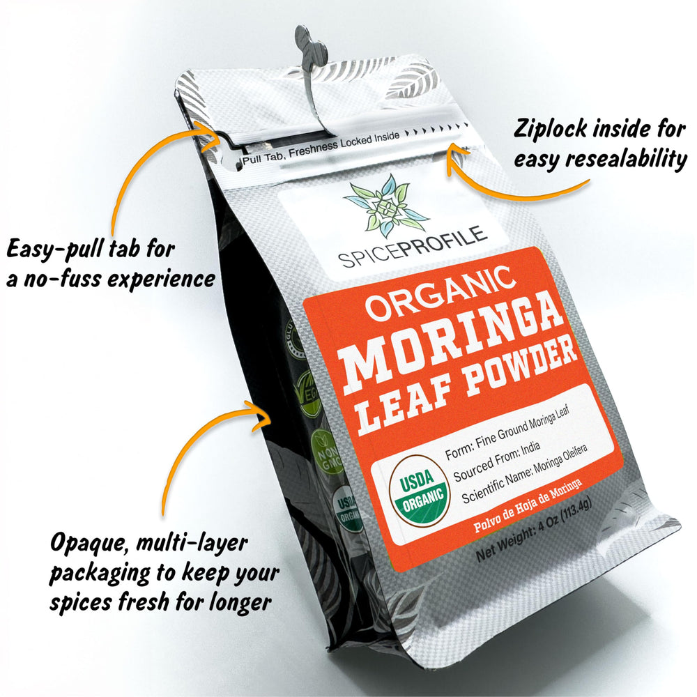 Vibrant green moringa powder on white